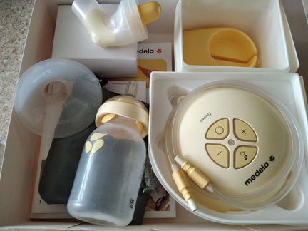 Молокоотсос Medela swing